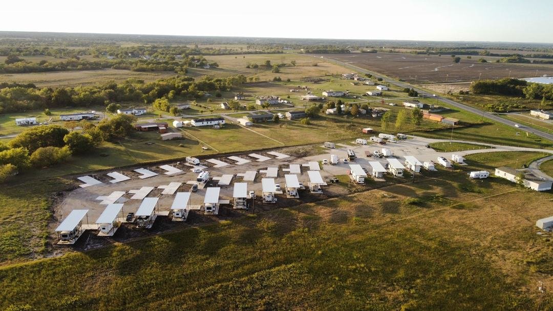 Aerial view of the full RV park grounds and covered sites