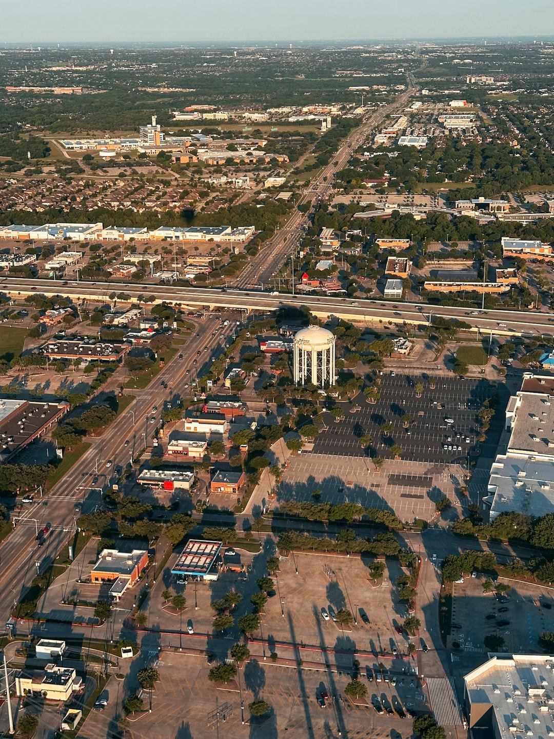 Aerial view of a North Texas town with a water tower
